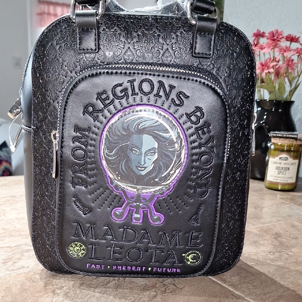 Madame Leota Black and Purple Women's Bag. Brand New With Cross Body Strap.